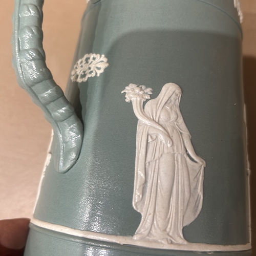 203 - Antique Wedgwood Style Jasperware jug features classical figures in blue with white relief. It is ma... 