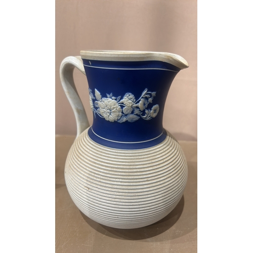 204 - A Large Antique Ridgeway Bedford Works Millan Blue and white jug, featuring relief floral decoration... 