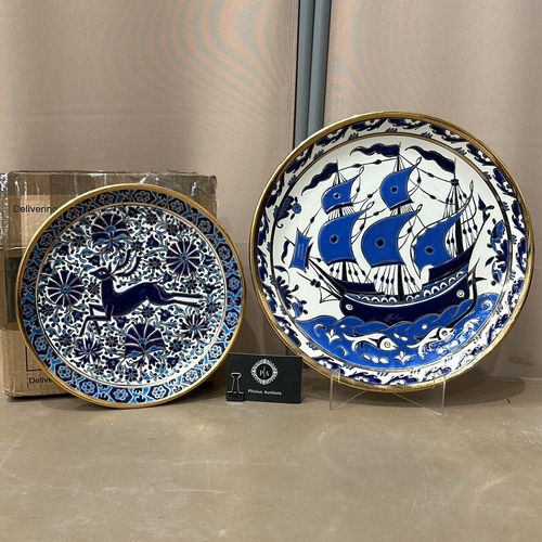 367 - 2 Large Mediterranean Ceramic plates features a blue ship and deer design, accented with floral moti... 