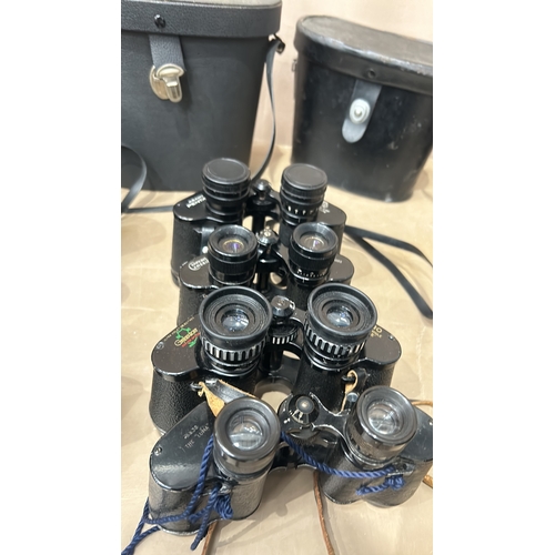 371 - Collection of vintage binoculars, various models, with leather cases. Brands include Greenkat and Mi... 