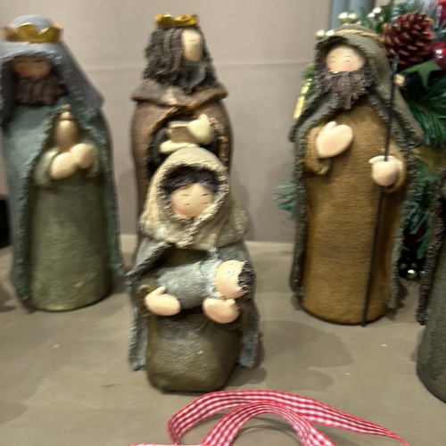 273 - Ceramic Nativity set featuring seven figurines, including Mary, Joseph, Baby Jesus, and the Three Wi... 