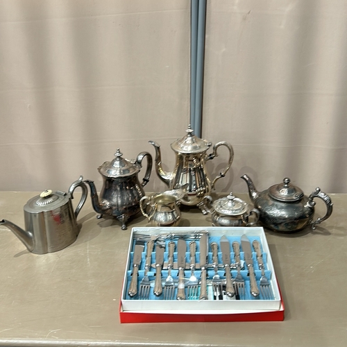 380 - Antique silver plate tea set with ornate detailing, includes various teapots, a sugar bowl, a cream ... 