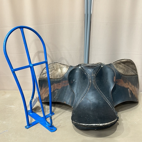 384 - blue metal Wall Mounted Saddle stand with vintage black leather saddle