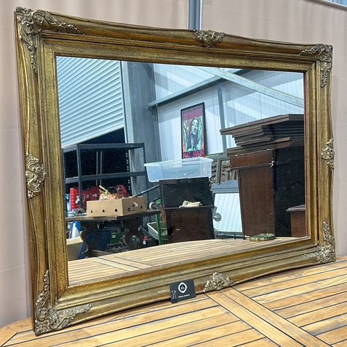 162 - A Large Gilded wood mirror frame with decorative floral corner accents, from the Victorian period st... 