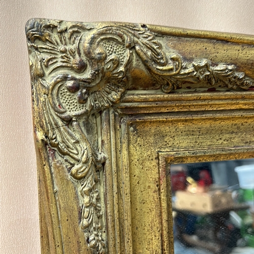 162 - A Large Gilded wood mirror frame with decorative floral corner accents, from the Victorian period st... 