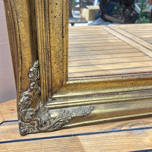 162 - A Large Gilded wood mirror frame with decorative floral corner accents, from the Victorian period st... 