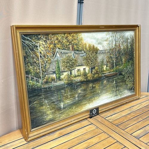 191 - Oil on canvas landscape depicts a serene riverside cottage scene, with autumnal foliage and reflecti... 