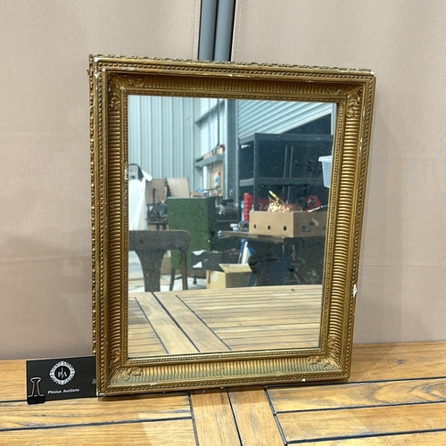 163 - Rectangular gilt mirror with ornate frame, featuring beaded and fluted detailing.