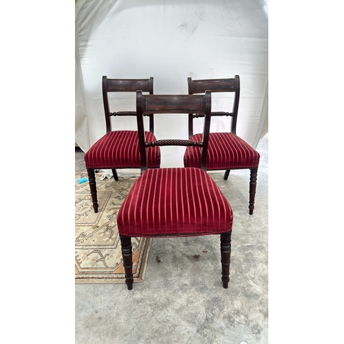 113 - Set of three Regency mahogany dining chairs featuring spiral turned supports and red striped velvet ... 