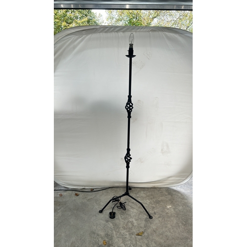 359 - A Tall Black metal floor lamp with tripod base, with intricate design. Good Condition