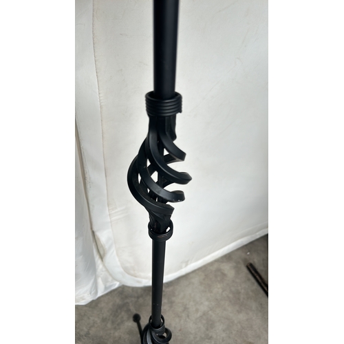 359 - A Tall Black metal floor lamp with tripod base, with intricate design. Good Condition