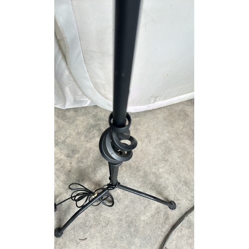 359 - A Tall Black metal floor lamp with tripod base, with intricate design. Good Condition