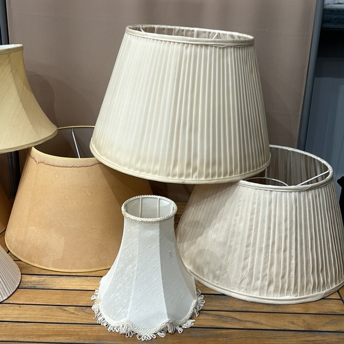 353 - Assorted fabric lampshades, various styles and sizes. Includes pleated and bell-shaped designs.