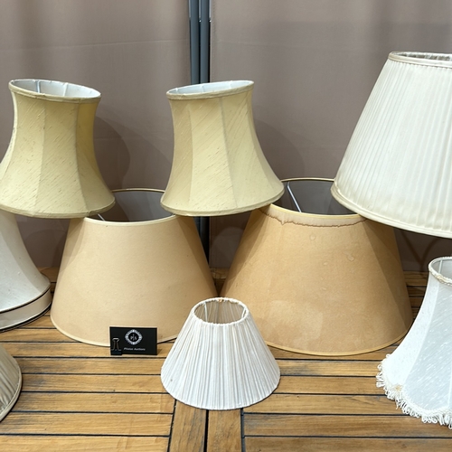 353 - Assorted fabric lampshades, various styles and sizes. Includes pleated and bell-shaped designs.