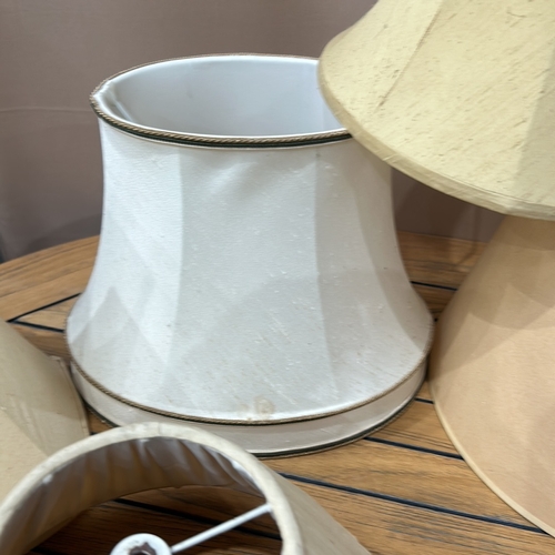 353 - Assorted fabric lampshades, various styles and sizes. Includes pleated and bell-shaped designs.