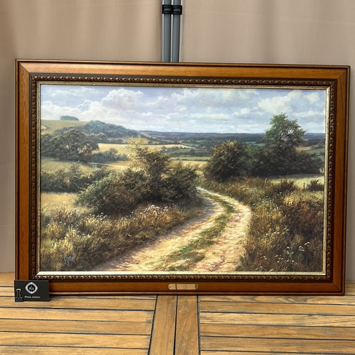 173 - Large print of an oil painting of a rural landscape with a winding path, framed in carved wood. Titl... 