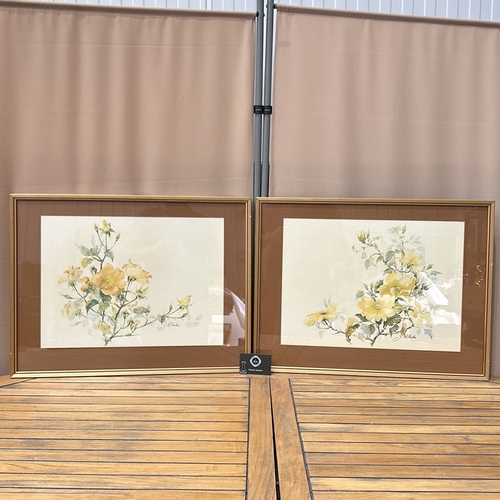 176 - Pair of watercolor floral prints, each featuring delicate yellow blossoms. Signed by J. Blake artist... 