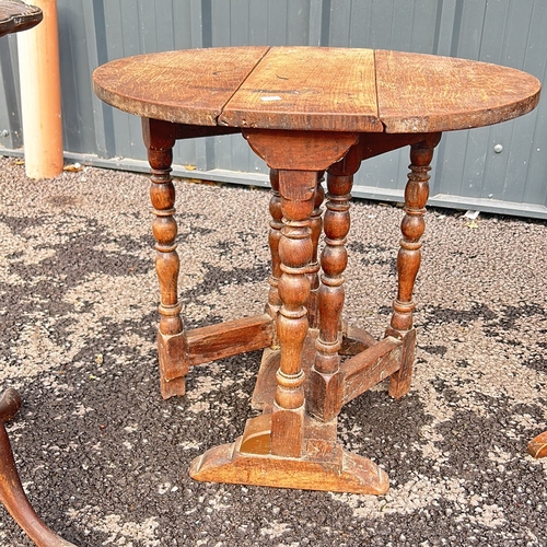 100 - Antique mahogany occasional table with drop leaves and two drawers, featuring a turned pedestal base... 