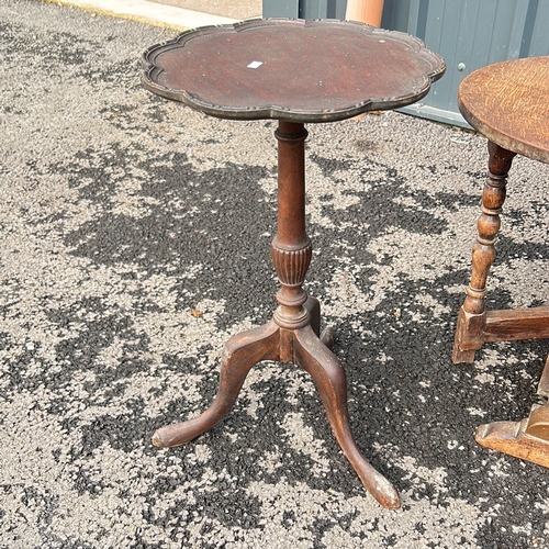 100 - Antique mahogany occasional table with drop leaves and two drawers, featuring a turned pedestal base... 