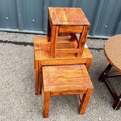 104 - Mixed lot includes a painted side table and drawer, a round copper covered table, and a set of three... 