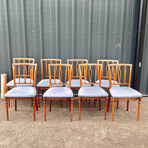 66 - Set of eight mahogany dining chairs with upholstered seats, featuring Georgian-style detailing and t... 