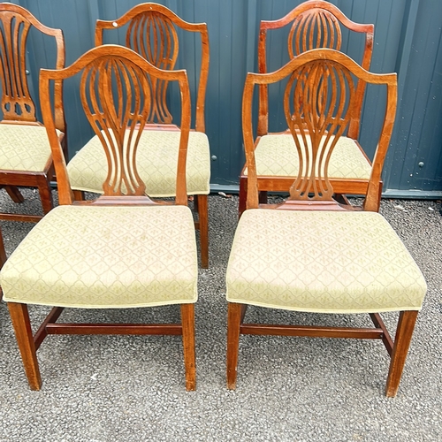 69 - Set of six mahogany dining chairs, featuring shield-back design and upholstered seats. From the Geor... 