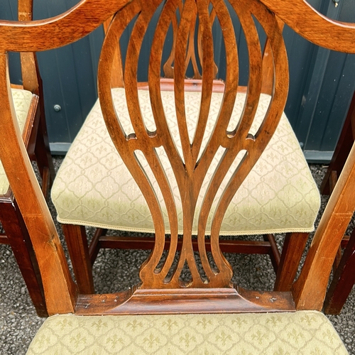 69 - Set of six mahogany dining chairs, featuring shield-back design and upholstered seats. From the Geor... 