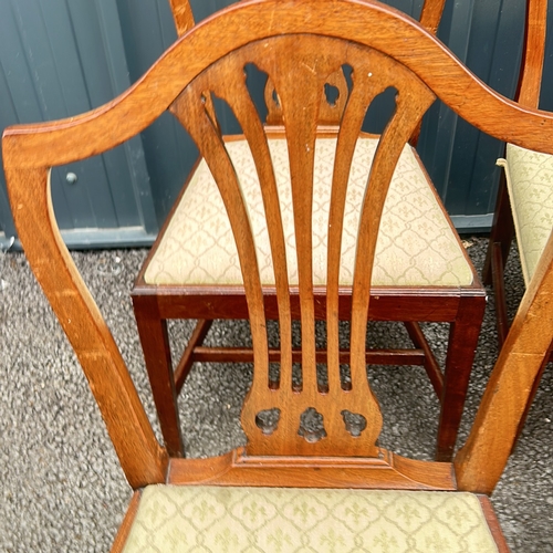 69 - Set of six mahogany dining chairs, featuring shield-back design and upholstered seats. From the Geor... 