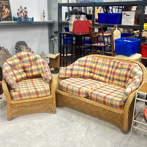 70 - Wicker furniture set with plaid cushions, includes one armchair and one loveseat. Suitable for indoo... 