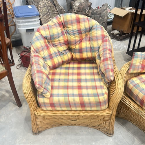 70 - Wicker furniture set with plaid cushions, includes one armchair and one loveseat. Suitable for indoo... 