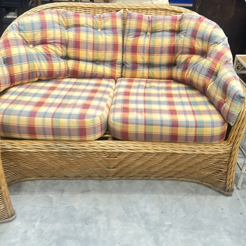 70 - Wicker furniture set with plaid cushions, includes one armchair and one loveseat. Suitable for indoo... 