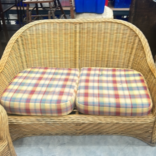 70 - Wicker furniture set with plaid cushions, includes one armchair and one loveseat. Suitable for indoo... 