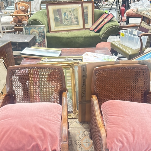 71 - bergere Arm Chairs featuring plush coral pink upholstery, displaying elegant carved wooden details.