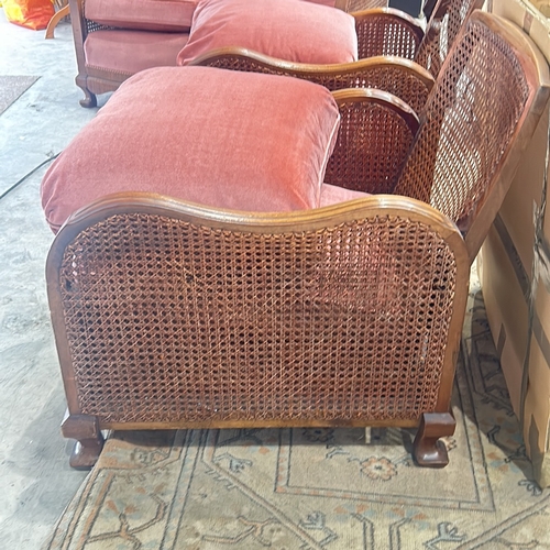 71 - bergere Arm Chairs featuring plush coral pink upholstery, displaying elegant carved wooden details.