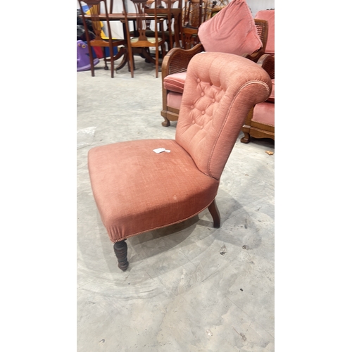 73 - Victorian style upholstered nursing armchair with pink tufted fabric. Features intricately turned wo... 