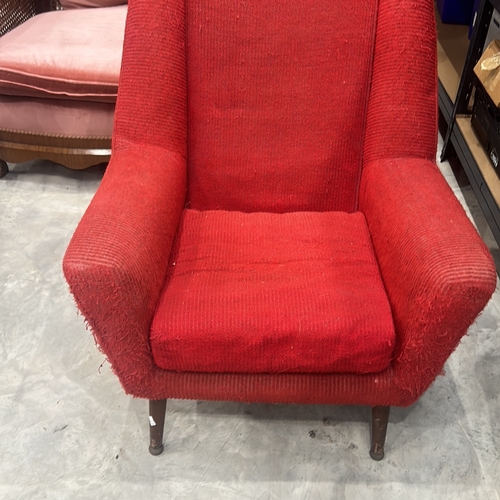 74 - Pair of Mid-Century Modern red upholstered armchairs with wooden legs, showcasing classic design ele... 