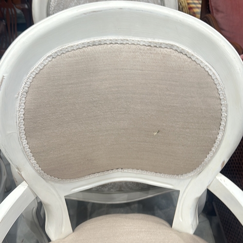 76 - Pair white-painted armchairs with upholstered seats and backs, featuring a classic French design wit... 