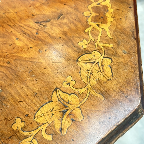 77 - Victorian walnut octagonal table features intricate marquetry inlay on top and elegant turned legs.