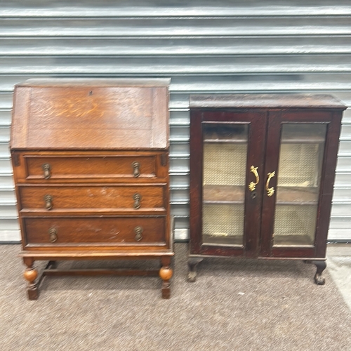 85 - Mahogany display cabinet with glass doors and brass handles, featuring cabriole legs from the early ... 