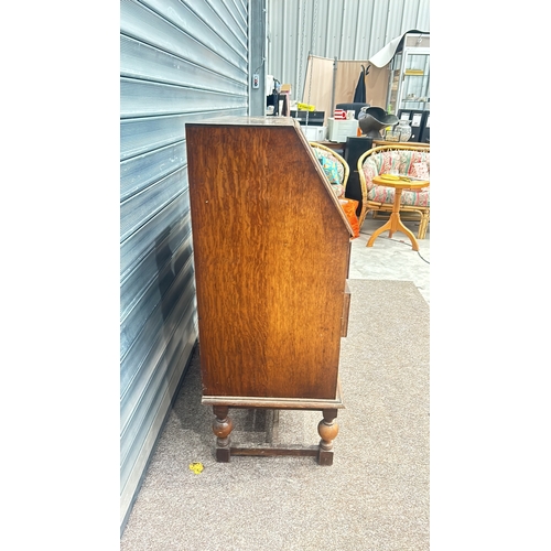 85 - Mahogany display cabinet with glass doors and brass handles, featuring cabriole legs from the early ... 