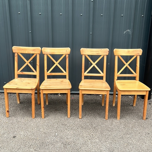 86 - Set of 4 Pine Wooden chairs with a natural finish, featuring a classic cross-back design and sturdy ... 