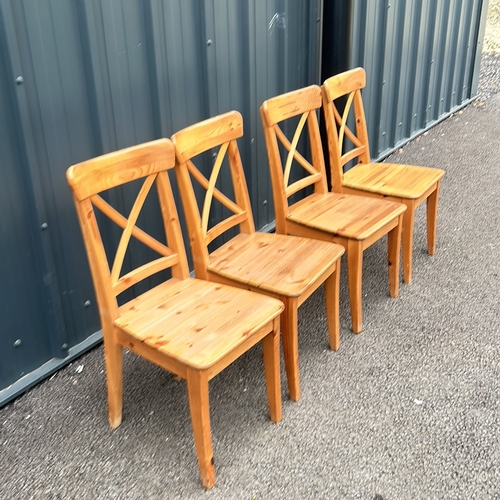 86 - Set of 4 Pine Wooden chairs with a natural finish, featuring a classic cross-back design and sturdy ... 