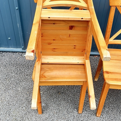 86 - Set of 4 Pine Wooden chairs with a natural finish, featuring a classic cross-back design and sturdy ... 