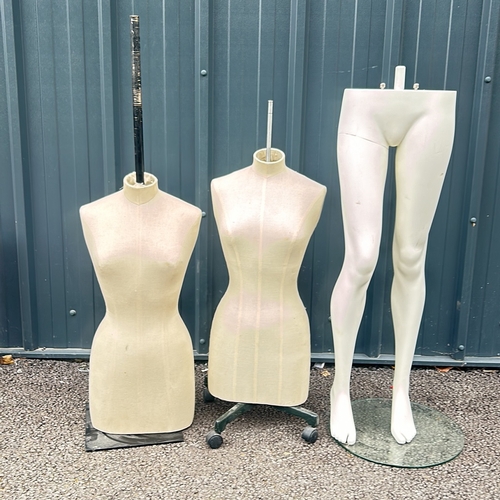 88 - Set of two dressmaker's mannequins with adjustable stands, accompanied by a mannequin lower half.