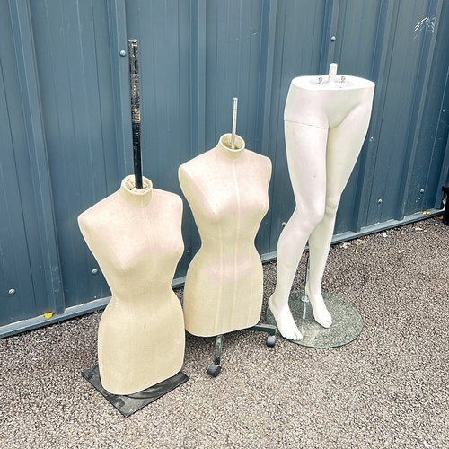 88 - Set of two dressmaker's mannequins with adjustable stands, accompanied by a mannequin lower half.