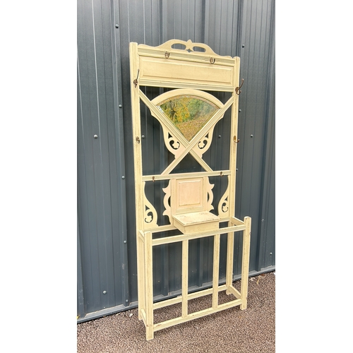 90 - Victorian wooden hall stand with mirror features intricate scrollwork and a distressed cream finish.... 