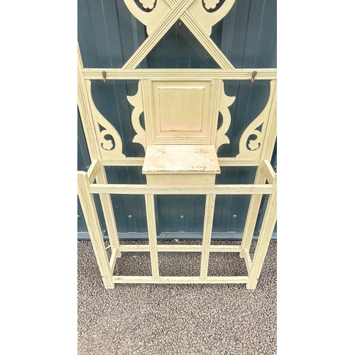 90 - Victorian wooden hall stand with mirror features intricate scrollwork and a distressed cream finish.... 