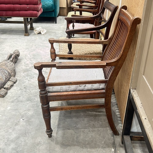 95 - Set of three vintage wooden chairs feature turned legs and distinctive back designs.