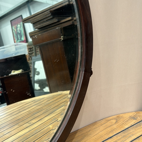 160 - Antique Large Round mirror with dark wooden frame, showcasing a simple and elegant design.