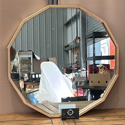 110 - Octagonal wall mirror with a metal frame, featuring a contemporary design.